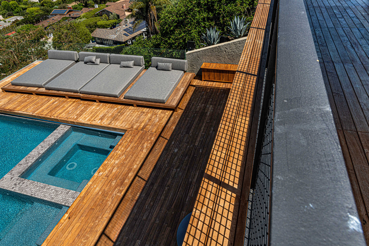 Deck edge, spa surround, and adjacent steps viewed from above