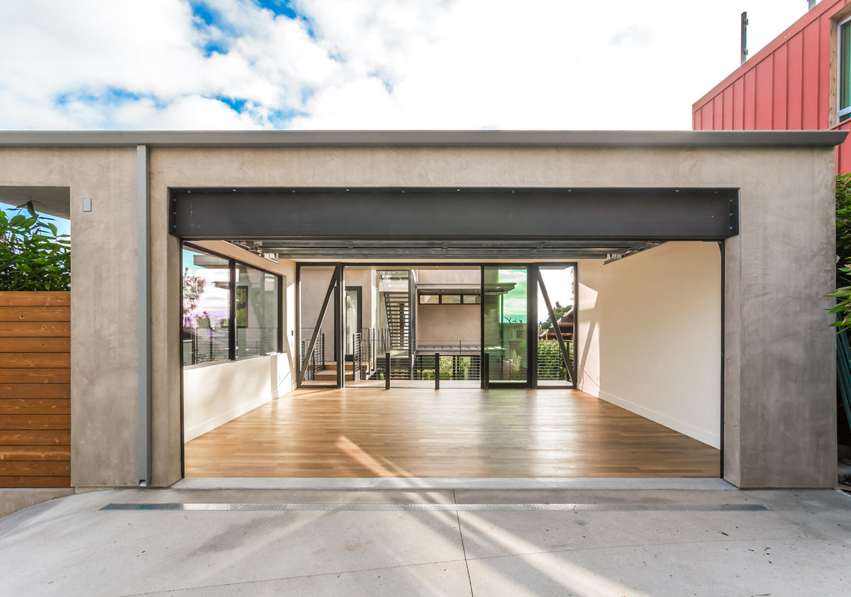 An open-sided rectangular room with wood flooring and a wide opening