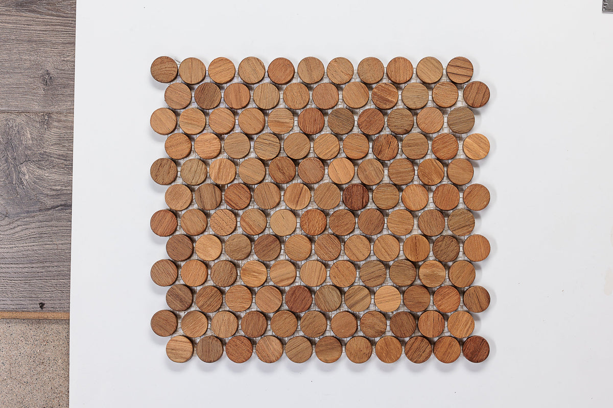 Round wood mosaic pieces with visible gaps on a white background