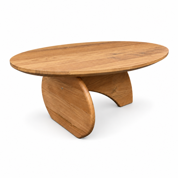 IndoTeak Design oval reclaimed teak coffee table with an interlocking curved base, three-quarter view on white